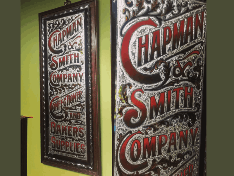 vintage sign with glue chipped glass